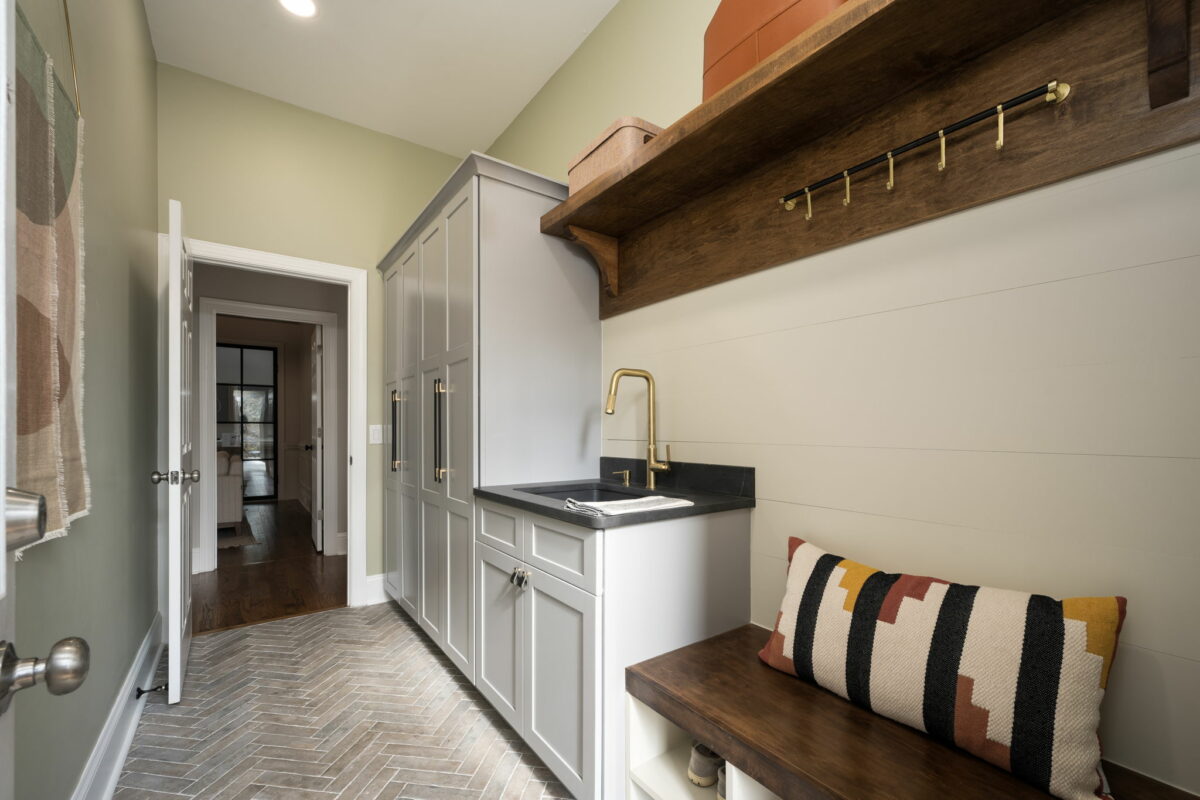 A mudroom hallway with a bench and a sink in Charlotte, NC